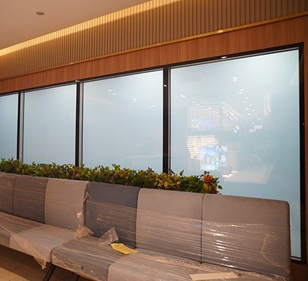 Switchable glass privacy partitions in a hospital healthcare interior - Royal Tint