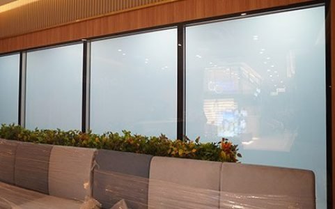 Switchable glass privacy partitions in a hospital healthcare interior - Royal Tint